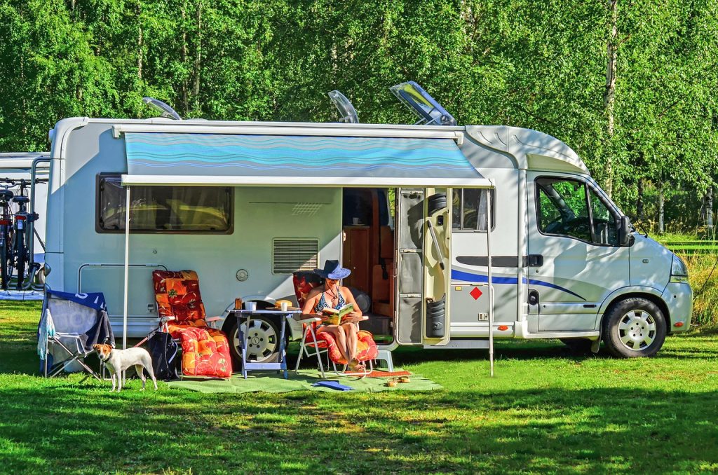 woman reading outside RV