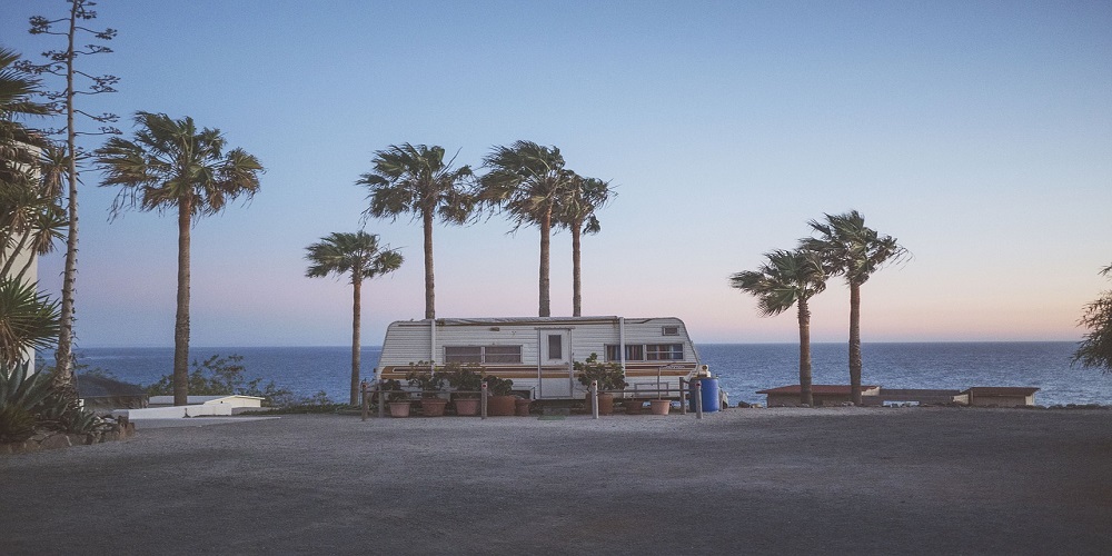 RV at the beach with palm trees