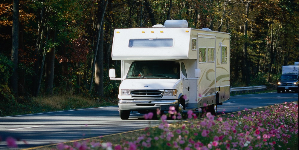 RV-on-road-with-flowers-in-foreground
